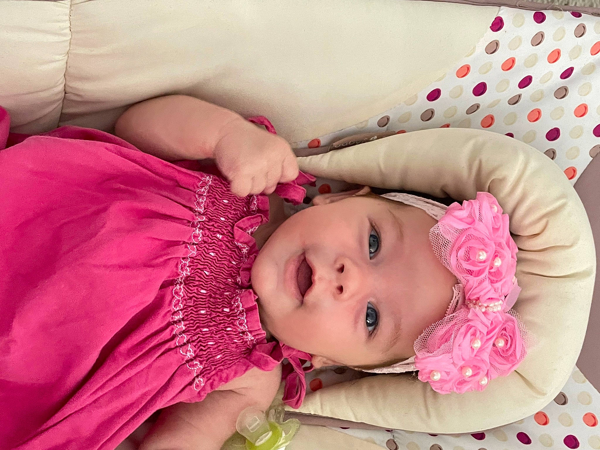 Angela participe au concours pour gagner de l'argent avec cette photo : baby, baby_products, baby_toddler_clothing, cheek, comfort, eye, eyelash, face, happy, headwear, lip, magenta, pattern, person, pink, red, skin, sleeve, smile, textile