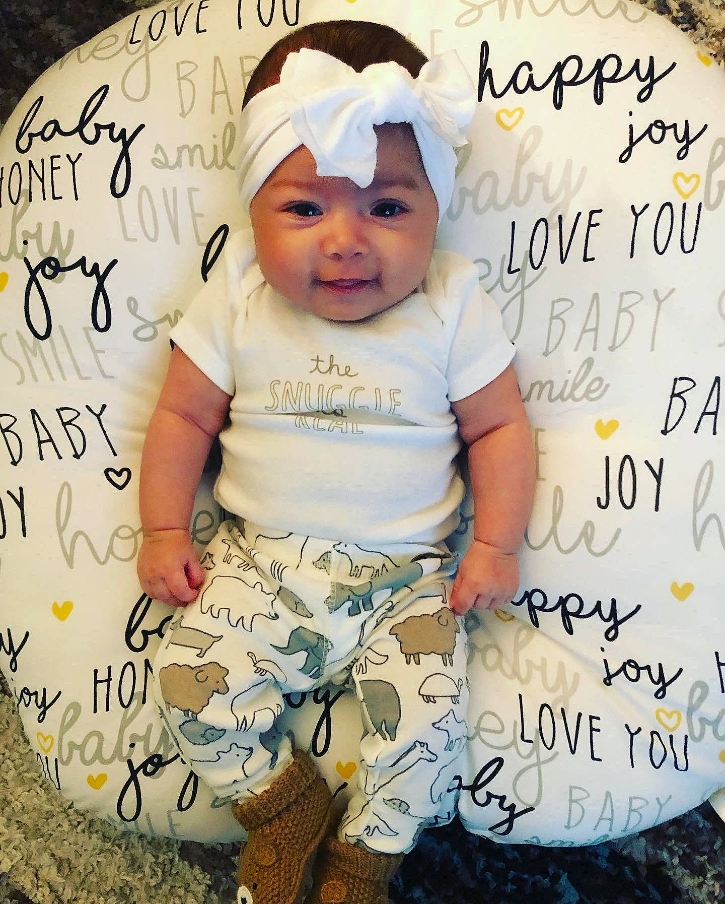 Maisy is registered to the contest to win money with this photo: baby, baby_products, baby_toddler_clothing, child, design, font, hair_accessory, happy, headgear, headwear, pattern, person, photo_caption, photography, product, toddler