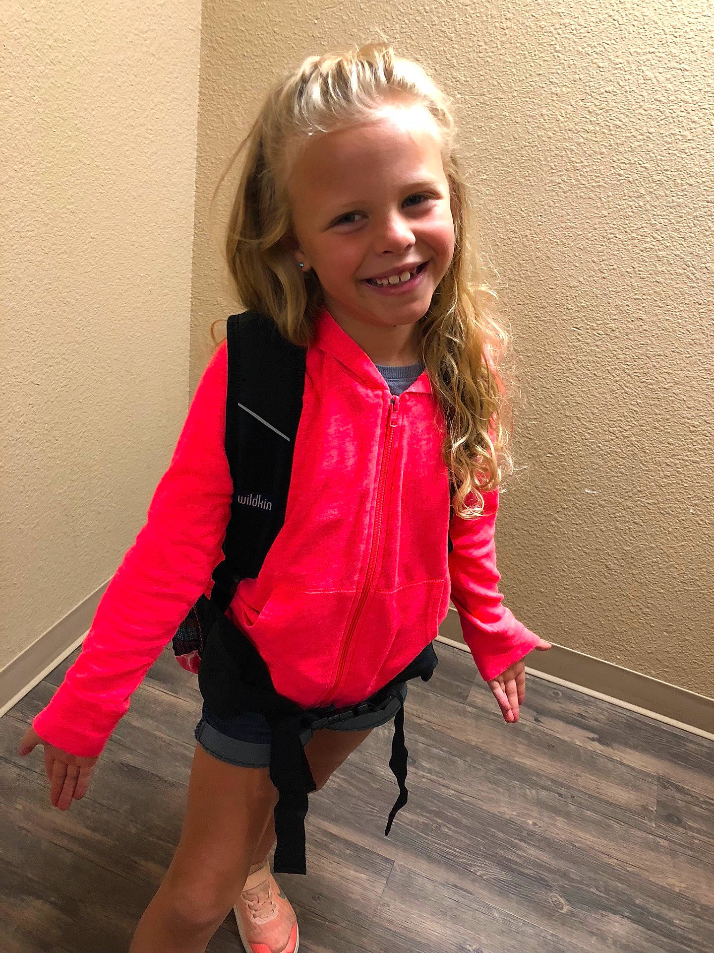 Bentlee is registered to the contest to win money with this photo: blond, child, child_model, clothing, day, facial_expression, footwear, fun, girl, hair, human_hair_color, joy, leg, outerwear, person, pink, red, shoulder, skin, smile