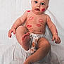 baby, infant, diaper, lipstick_marks, face, foot, hand, skin, blue_eyes, lying_down, white_sheet, cute, chubby, playful, child, expression, human, portrait, body, adorable