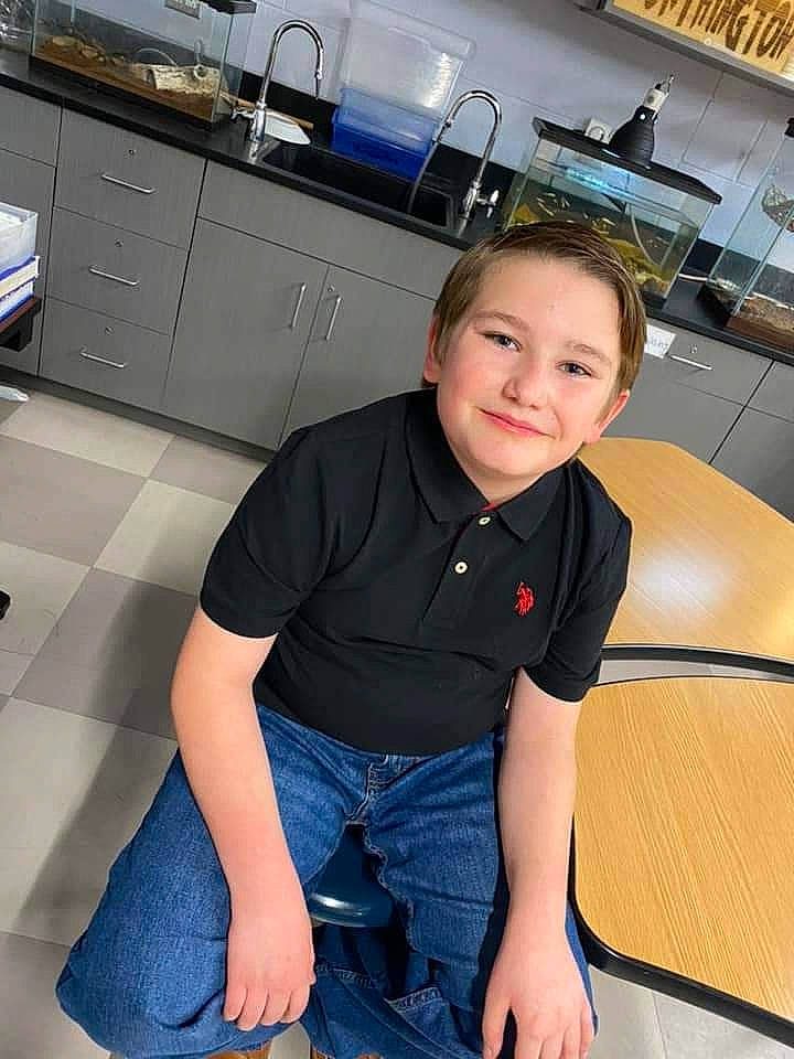 Legend is registered to the contest to win money with this photo: automotive_design, black, cabinetry, countertop, drawer, electric_blue, floor, flooring, fun, hardwood, human_leg, joint, joy, kitchen, knee, person, shoulder, sleeve, smile, thigh