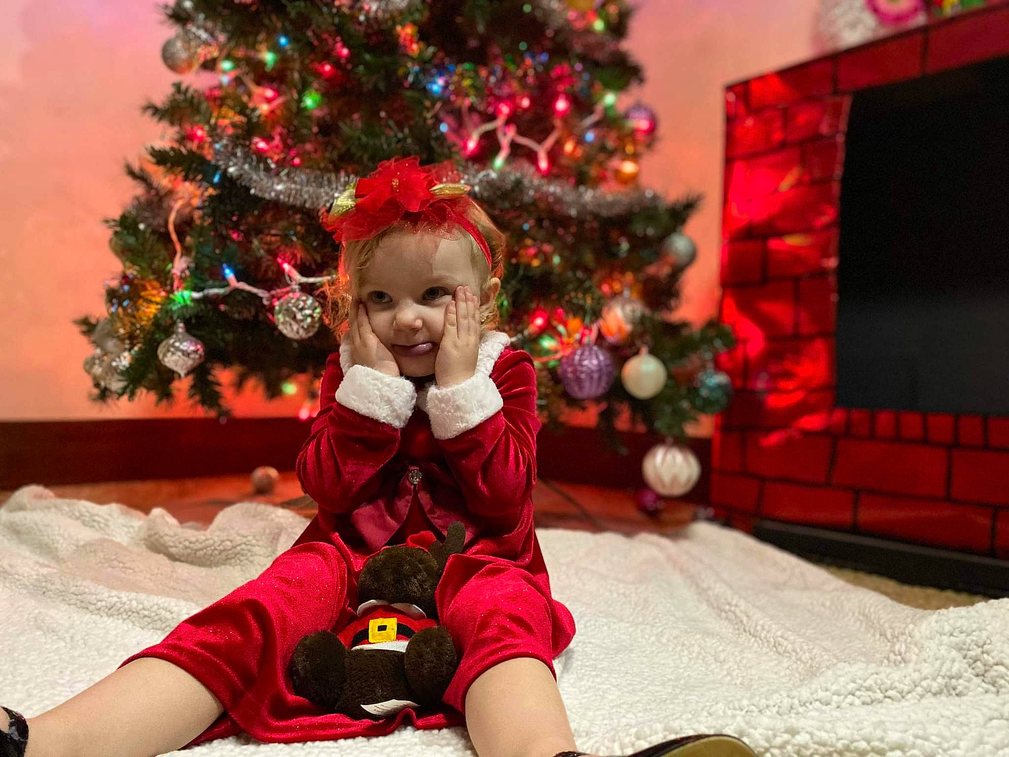 Legacy is registered to the contest to win money with this photo: beauty, christmas, christmas_decoration, christmas_eve, christmas_ornament, christmas_tree, event, fun, happy, holiday, lap, ornament, person, photograph, plant, red, smile, toddler, tradition, tree