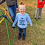 child, boy, glasses, mohawk, smile, shirt, jeans, shoes, playground, grass, backyard, fence, person, casual_clothing, outdoor, happy, friends, kids, play, daytime