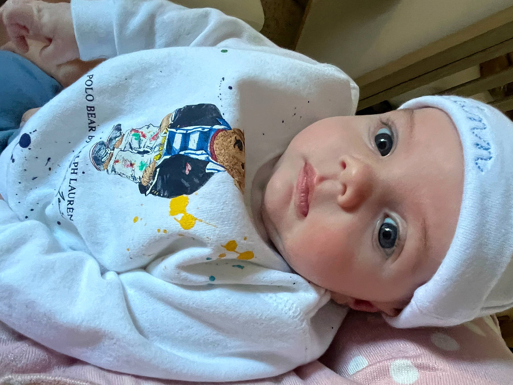 Quinn is registered to the contest to win money with this photo: baby, baby_products, baby_safety, baby_sleeping, baby_toddler_clothing, cheek, child, comfort, happy, hat, headgear, headwear, linens, nose, person, room, skin, sleeve, toddler, white