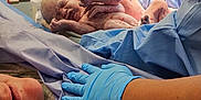 Luna is registered to the contest to win money with this photo: adult, architecture, baby, building, childbirth, clinic, clothing, doctor, face, glove, hat, head, hospital, indoors, male, man, medicalprocedure, operatingtheatre, people, person