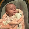 baby, infant, sleeping, portrait, car_seat, blanket, pink_blanket, plush_blanket, cozy, indoors, seated, peaceful, closed_eyes, face, head, baby_clothing, soft_texture, nursery, adorable, photography