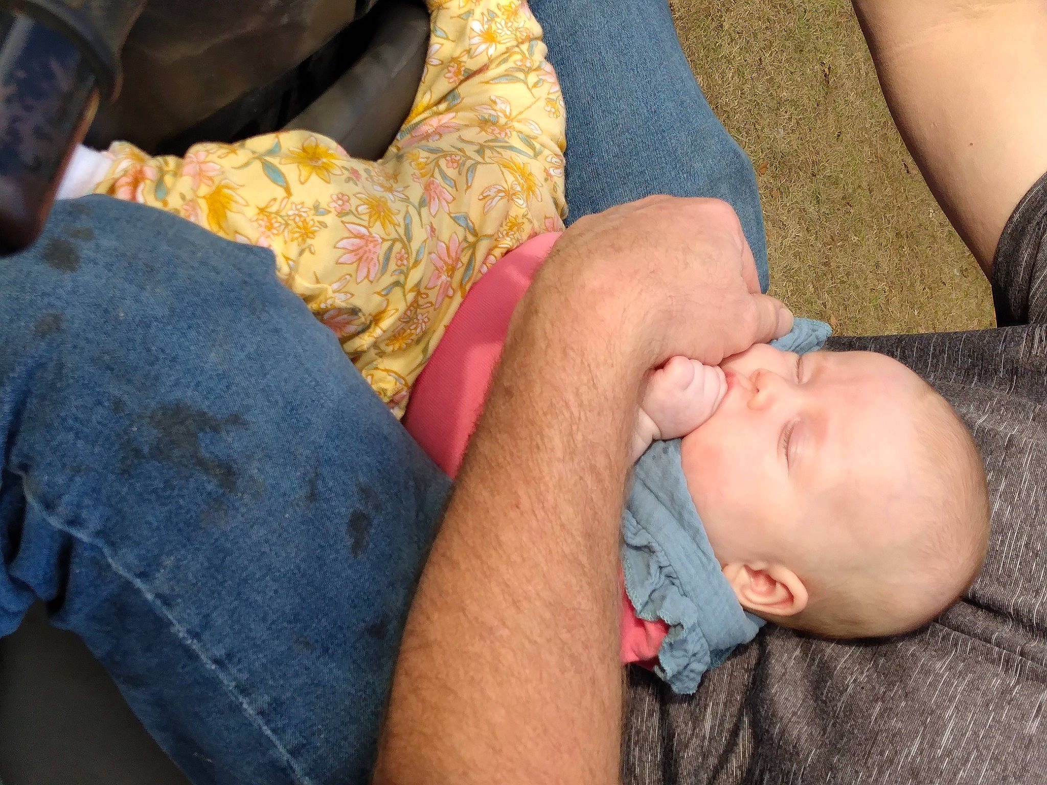 Jacee is registered to the contest to win money with this photo: baby, baby_toddler_clothing, cheek, child, comfort, eye, finger, gesture, grass, headgear, human_body, human_leg, mouth, nail, person, skin, thigh, thumb, toddler, tree