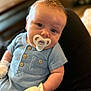 Samuel joined the competition — help win amazing prizes! baby, pacifier, blue_outfit, mittens, infant, close_up, person, face, child, young, sitting, comfort, indoor, portrait, cute, small, hands, button, fabric, skin