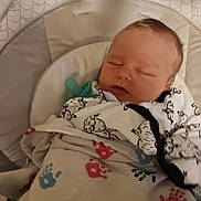 Samuel is registered to the contest to win money with this photo: baby, sleeping, blanket, pacifier, baby_seat, infant, cozy, cute, face, child, resting, soft, comfort, newborn, clothing, pattern, indoor, peaceful, cushion, wrapped