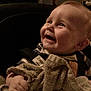 Samuel is registered to the contest to win money with this photo: baby, car_seat, child, clothing, cute, expression, face, hand, happy, head, indoor, infant, person, portrait, seat, seatbelt, smile, towel, warm_lighting, young