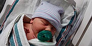 Samuel is registered to the contest to win money with this photo: baby, bassinet, bed, blanket, child, crib, cute, hat, hospital, hospital_room, infant, medical, newborn, nursery, pacifier, person, resting, sleeping, soft, wrapped