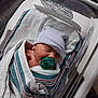 Samuel is registered to the contest to win money with this photo: newborn, baby, hospital, bassinet, blanket, pacifier, hat, sleeping, infant, wrapped, bed, medical, crib, person, cute, soft, resting, child, nursery, hospital_room