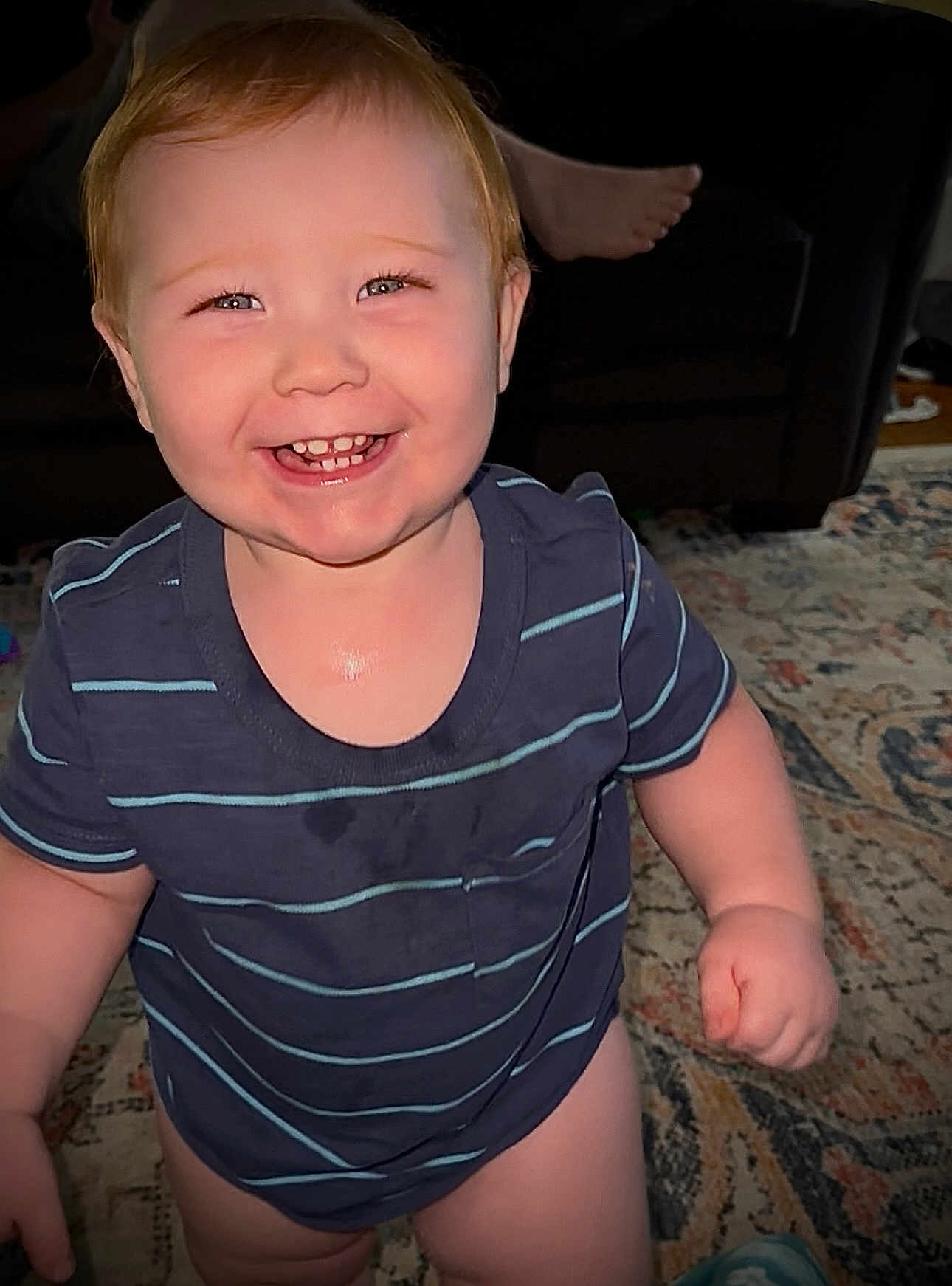 Lucas joined the competition — help win amazing prizes! baby, carpet, cheerful, child, couch, cute, face, foot, furniture, happy, human, indoor, person, portrait, rug, smiling, standing, striped_shirt, toddler, young_child