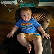Lucas joined the competition — help win amazing prizes! blue_tshirt, casual_clothing, child, cute, doorway, face, furniture, happy, home, indoor, light, person, recliner, relaxed, rug, shoes, smiling, toddler, wooden_floor, yellow_shorts