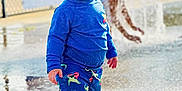 Lucas joined the competition — help win amazing prizes! background, blue_clothing, child, daytime, fence, fun, hat, outdoor, person, play, recreation, splash_pad, summer, sunny, toddler, water, water_droplets, water_shoes, water_spray, wet_surface
