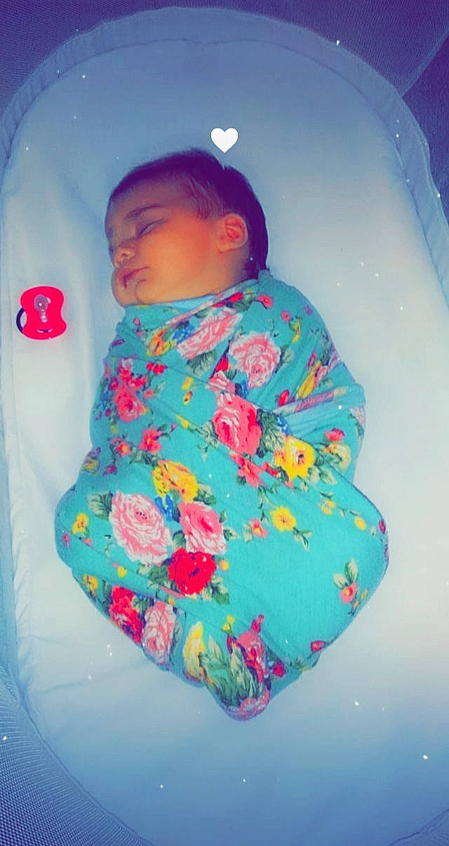 Gracelynn is registered to the contest to win money with this photo: baby, baby_products, baby_sleeping, baby_toddler_clothing, child, circle, comfort, cool, electric_blue, fun, linens, magenta, outerwear, pattern, person, pink, room, sitting, sleeve, t_shirt