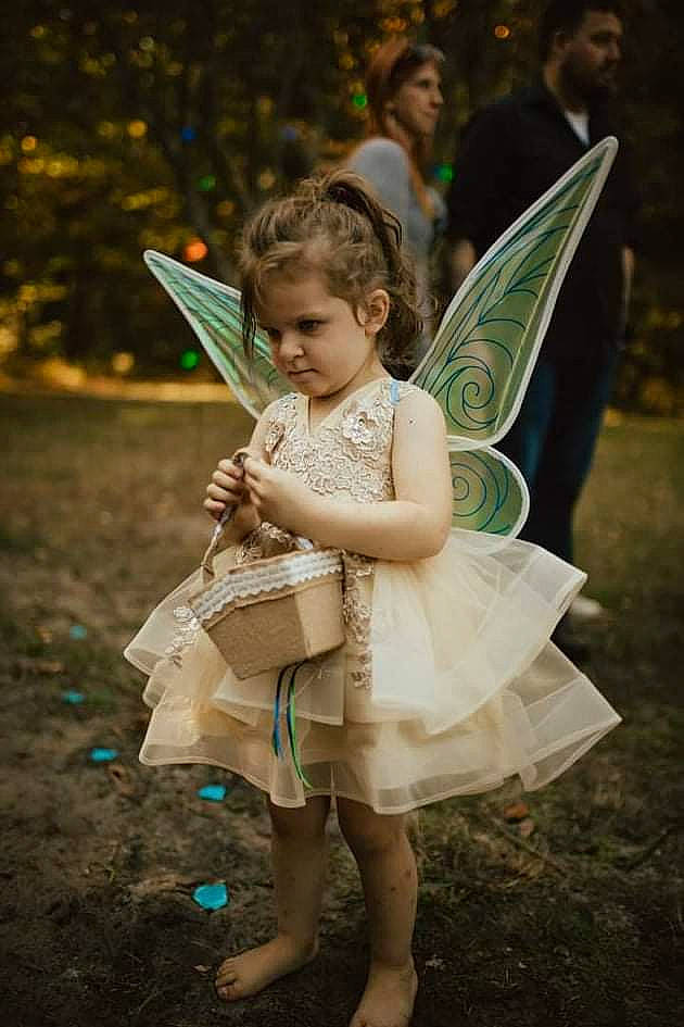Aubrey joined the competition — help win amazing prizes! beauty, butterfly, child, facial_expression, flash_photography, fun, grass, happy, lawn, leaf, leisure, mythical_creature, people_in_nature, person, pink, pollinator, skin, standing, sunlight, under_exposed