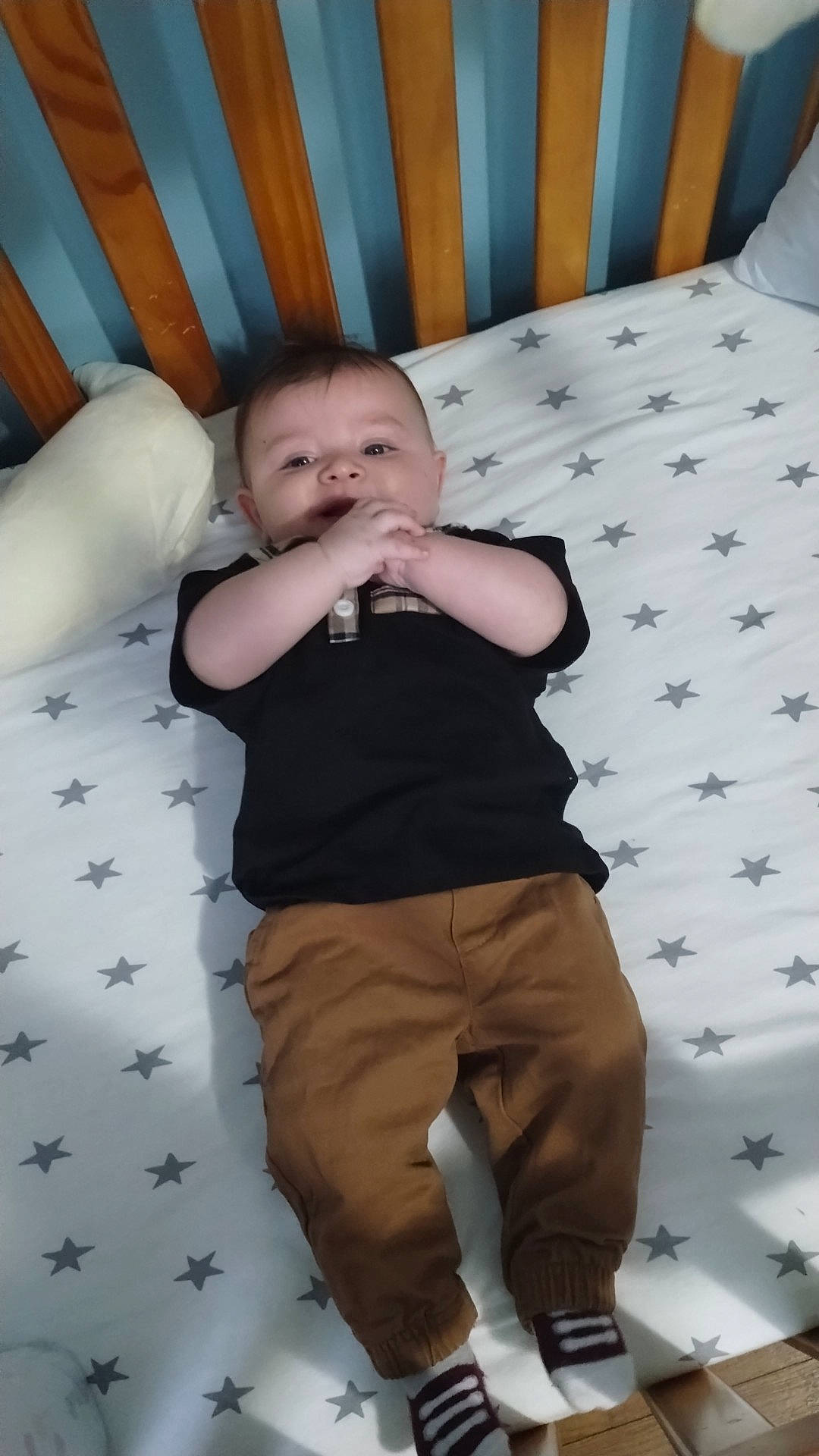 Evander joined the competition — help win amazing prizes! baby, baby_toddler_clothing, chair, child, comfort, flooring, fun, human_leg, khaki_pants, linens, pattern, person, product, room, sitting, sleeve, t_shirt, textile, toddler, white