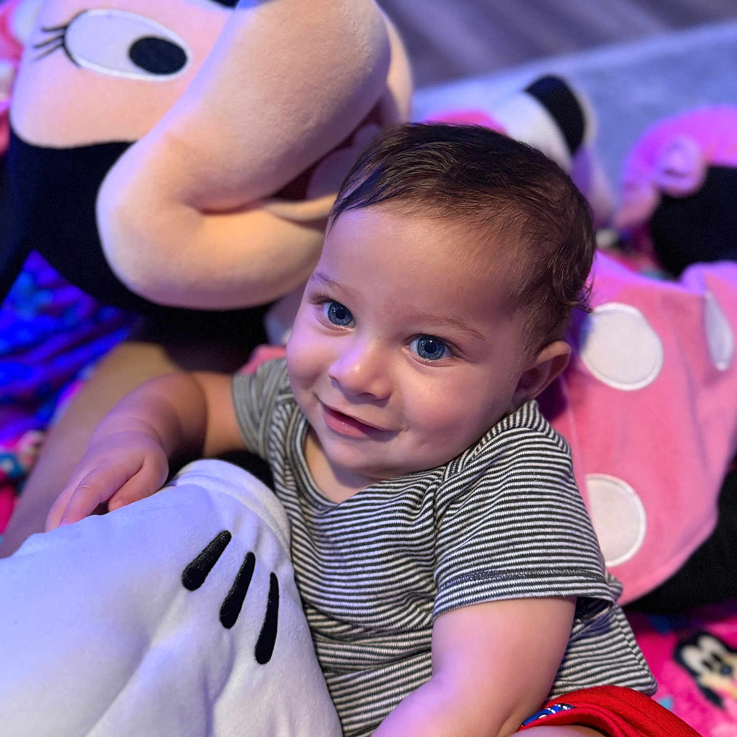 Karas joined the competition — help win amazing prizes! baby, blue_eyes, child, closeup, cozy, cuddly, cute, floor, happy, indoor, minnie_mouse, person, playful, plush_toy, portrait, red_shorts, smile, soft_toy, striped_shirt, toddler