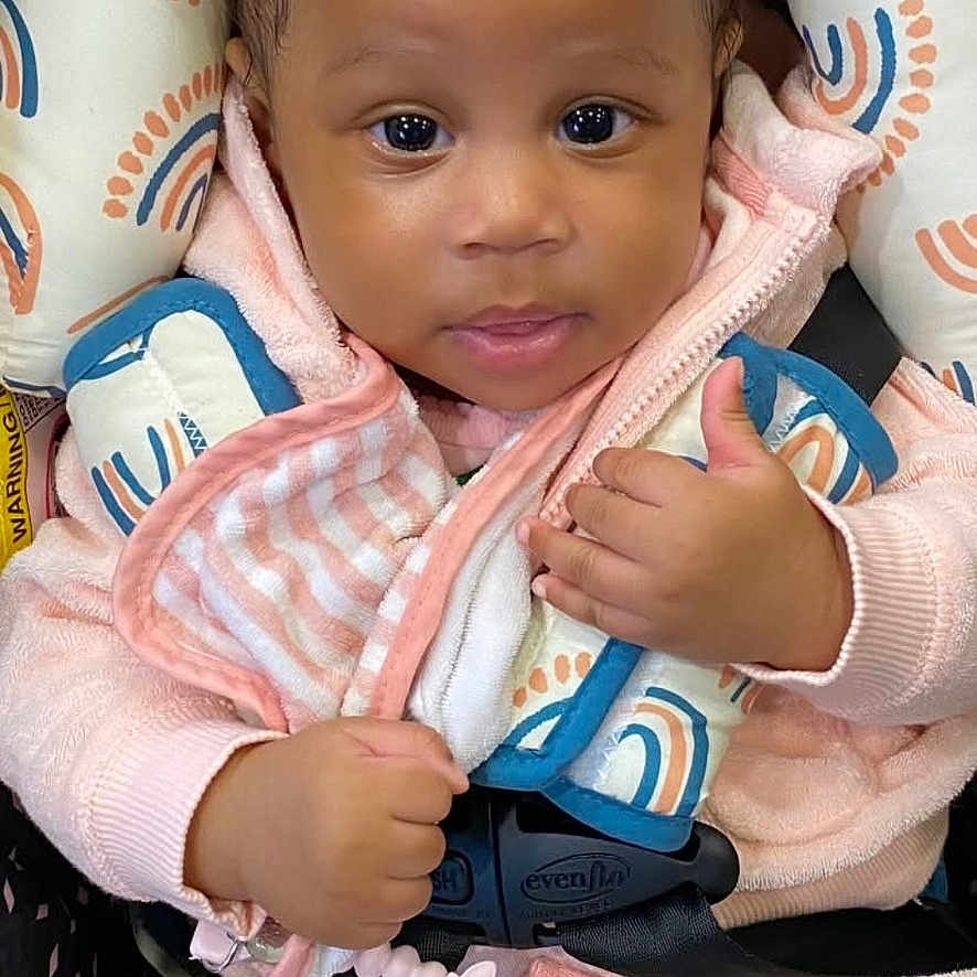 Ny'Ari is registered to the contest to win money with this photo: baby, bodypart, bonnet, clothing, cushion, face, finger, footwear, glove, hand, happy, hat, head, homedecor, newborn, person, photography, portrait, shoe, toy