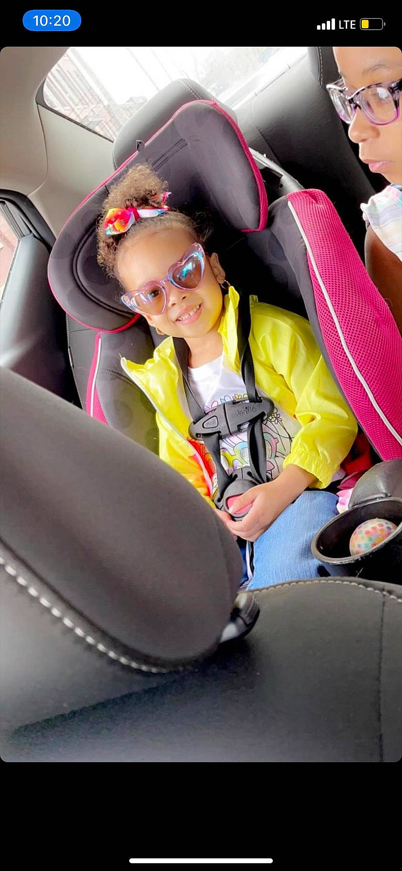 Ariah is registered to the contest to win money with this photo: air_travel, airline, auto_part, automotive_design, car_seat, car_seat_cover, child, comfort, eyewear, fun, head_restraint, joy, motor_vehicle, person, personal_protective_equipment, seat_belt, shorts, sneakers, steering_wheel, toddler