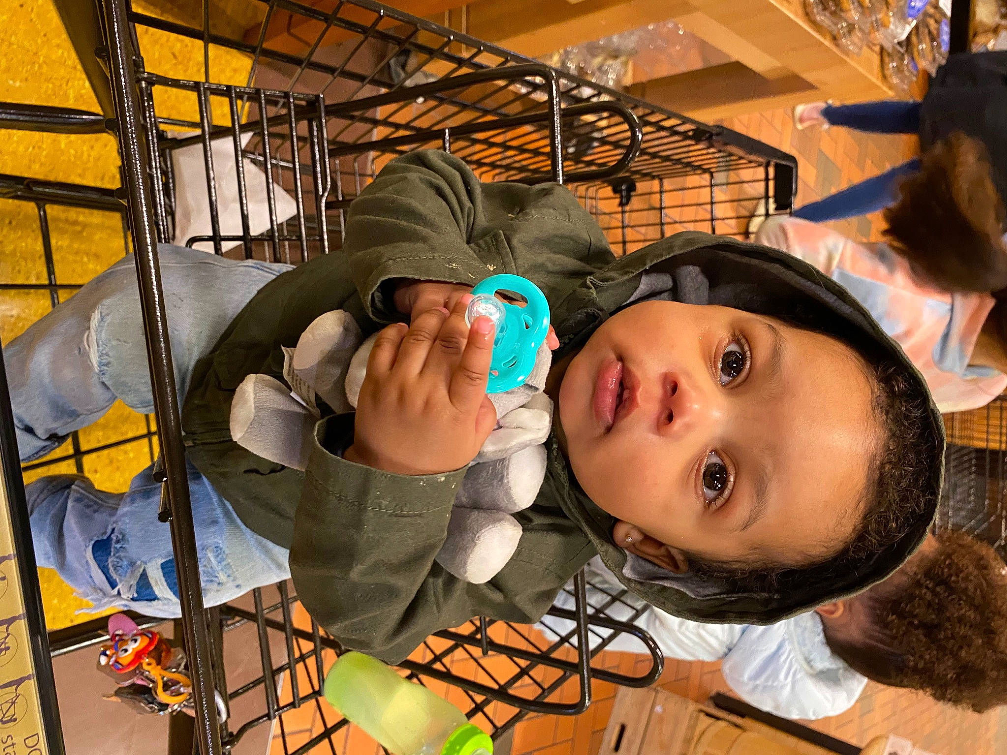 Liam joined the competition — help win amazing prizes! audio_equipment, baby, blue_collar_worker, child, eyelash, eyewear, fun, headgear, hoodie, machine, metal, mouth, person, personal_protective_equipment, sitting, toddler