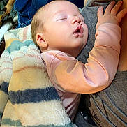 Remedy joined the competition — help win amazing prizes! baby, sleeping, blanket, cuddle, cozy, comfort, infant, person, child, rest, soft, warm, striped_blanket, hand, face, nap, indoors, clothing, toddler, parent