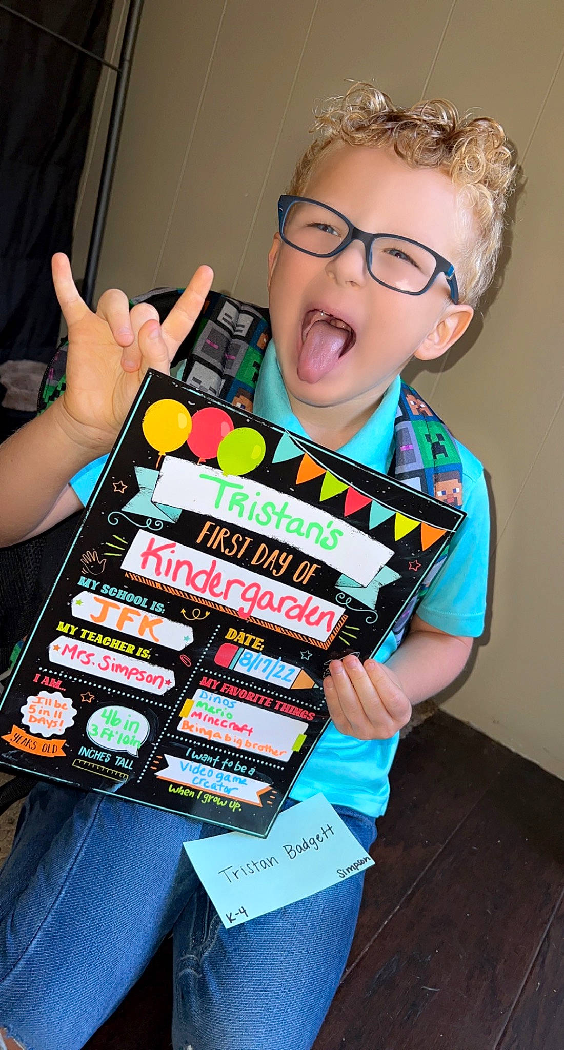 Tristan is registered to the contest to win money with this photo: child, confectionery, electronic_instrument, event, eyewear, fashion_design, food, fun, gadget, glasses, junk_food, machine, nail, office_equipment, person, recreation, smile, sweetness, t_shirt, toddler