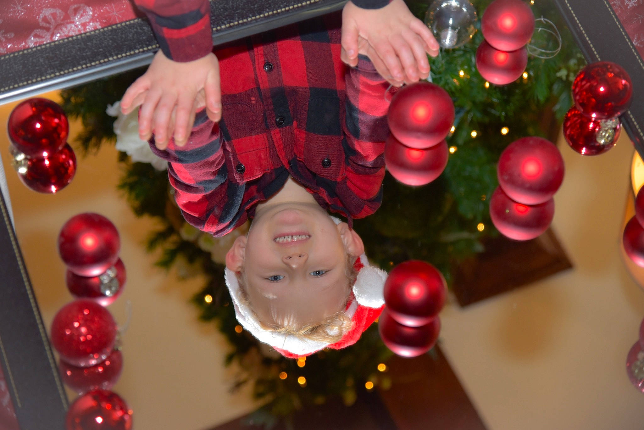 Tristan is registered to the contest to win money with this photo: christmas, christmas_decoration, christmas_eve, christmas_ornament, circle, decoration, event, fun, glass, happy, holiday, holiday_ornament, joy, light, magenta, ornament, party_supply, person, plaid, red