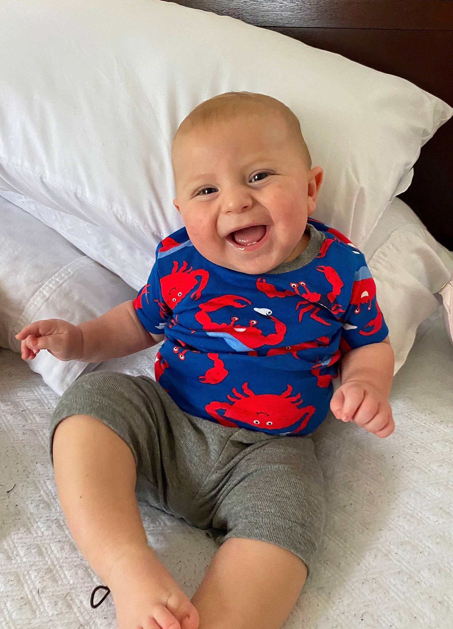 Iver is registered to the contest to win money with this photo: arm, baby, baby_products, baby_toddler_clothing, child, facial_expression, head, leg, mouth, person, product, sitting, skin, sleeve, smile, toddler