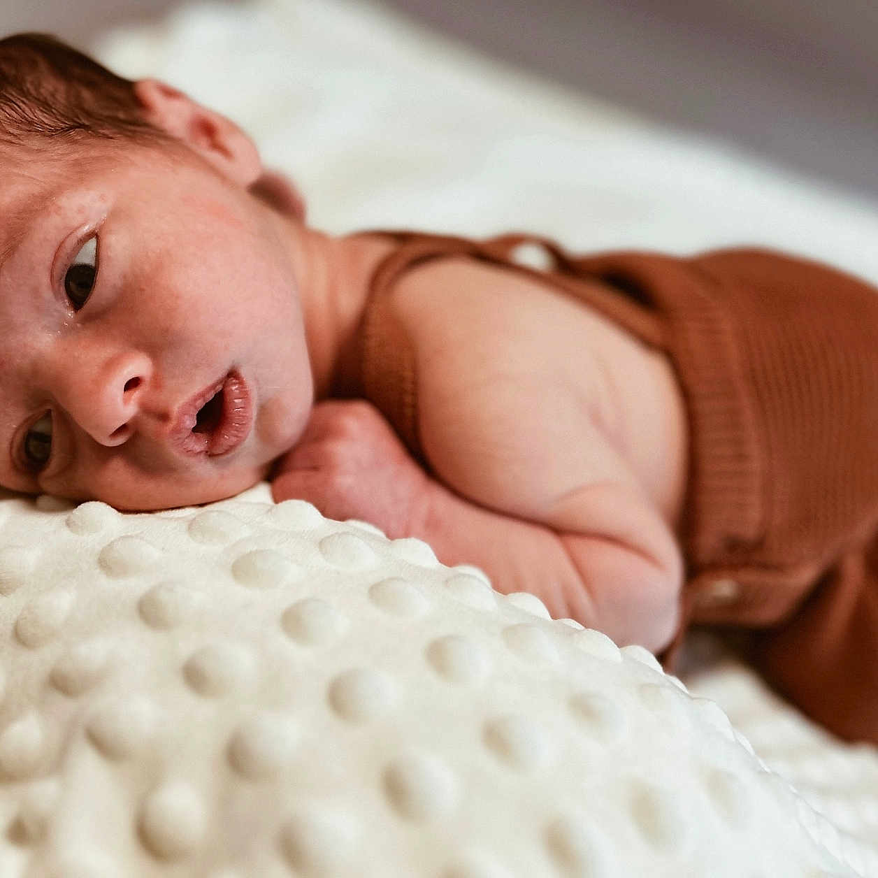 Elias joined the competition — help win amazing prizes! baby, blanket, face, happy, head, newborn, person, photography, portrait, sleeping, smile