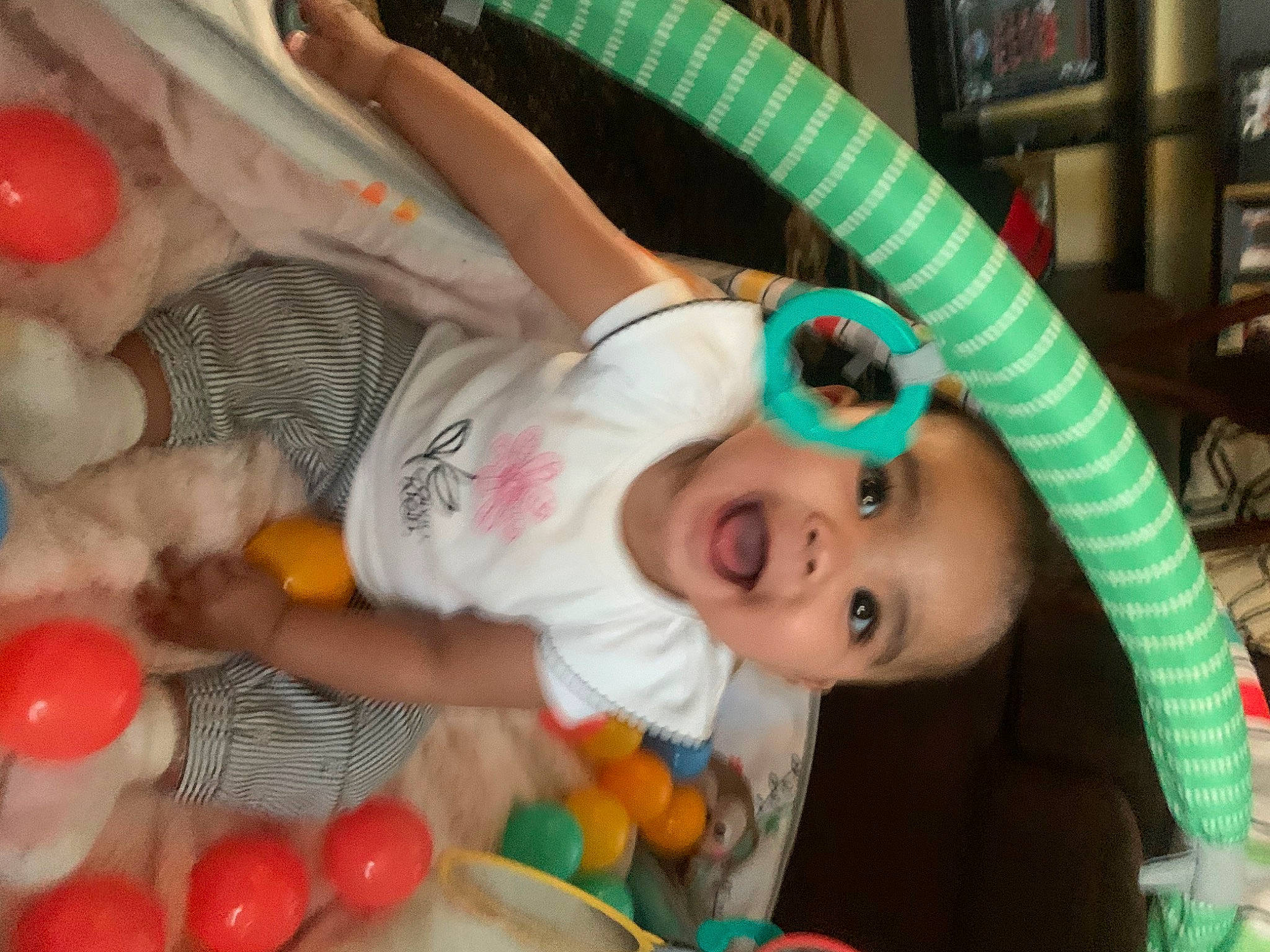 Auria H is registered to the contest to win money with this photo: baby, baby_products, chair, cheek, child, event, facial_expression, fun, happy, iris, leisure, mouth, nose, person, picture_frame, plastic, product, skin, textile, toddler