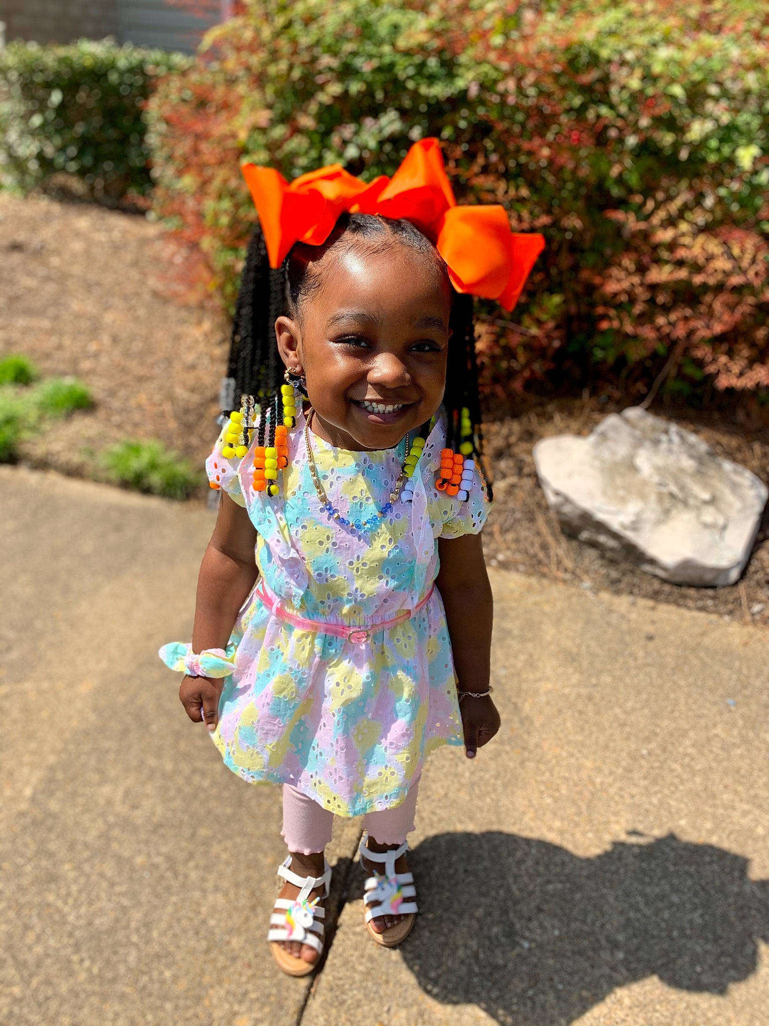 Madalyn is registered to the contest to win money with this photo: adaptation, asphalt, child, dress, event, eye, face, fashion_accessory, fun, grass, happy, jewellery, joy, leisure, magenta, pattern, person, plant, sandal, smile