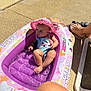 Manessa Ayna participe au concours pour gagner de l'argent avec cette photo : baby, child, colorful, cute, feet, inflatable_pool, knee, outdoor, pink, plastic, playful, poolside, relaxing, shadow, sitting, summer, sunhat, sunlight, swimsuit, water