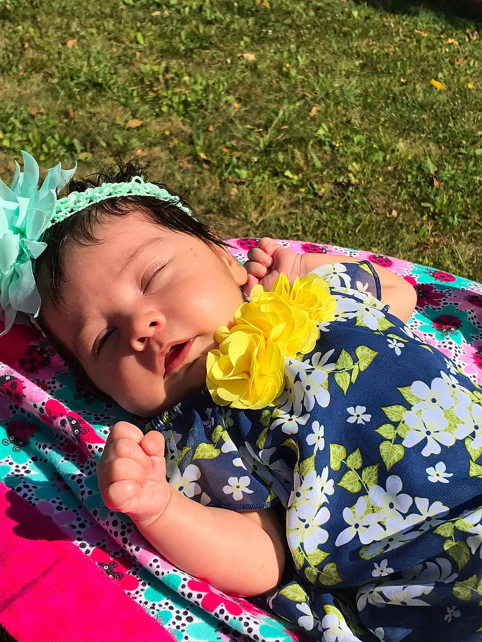 Mireya is registered to the contest to win money with this photo: baby, baby_toddler_clothing, botany, child, fun, grass, happy, headband, headpiece, jewellery, leisure, magenta, pattern, people_in_nature, person, pink, plant, sitting, spring, summer