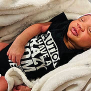 Wizdom joined the competition — help win amazing prizes! baby, blanket, child, clothing, cozy, cute, face, hand, hat, indoors, infant, newborn, peaceful, person, portrait, resting, skin, sleeping, soft, toddler