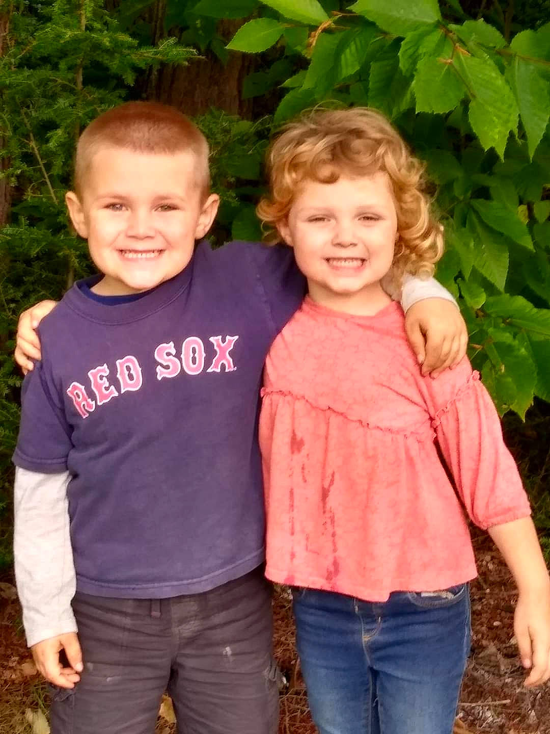 Connor is registered to the contest to win money with this photo: beauty, child, clothing, facial_expression, fun, gesture, grass, green, hairstyle, happy, joy, leaf, nature, outerwear, people_in_nature, person, plant, sleeve, smile, summer