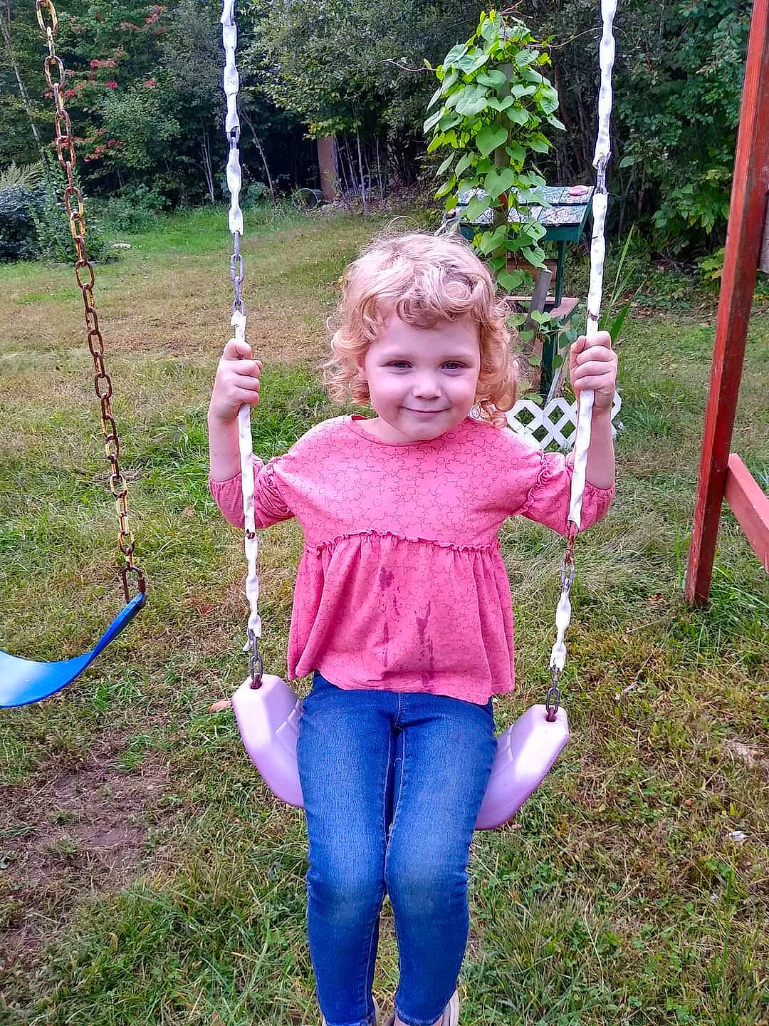 Catie is registered to the contest to win money with this photo: botany, child, electric_blue, fun, grass, green, happy, joy, leaf, leisure, person, plant, playground, playing_sports, recreation, smile, summer, swing, toddler, tree