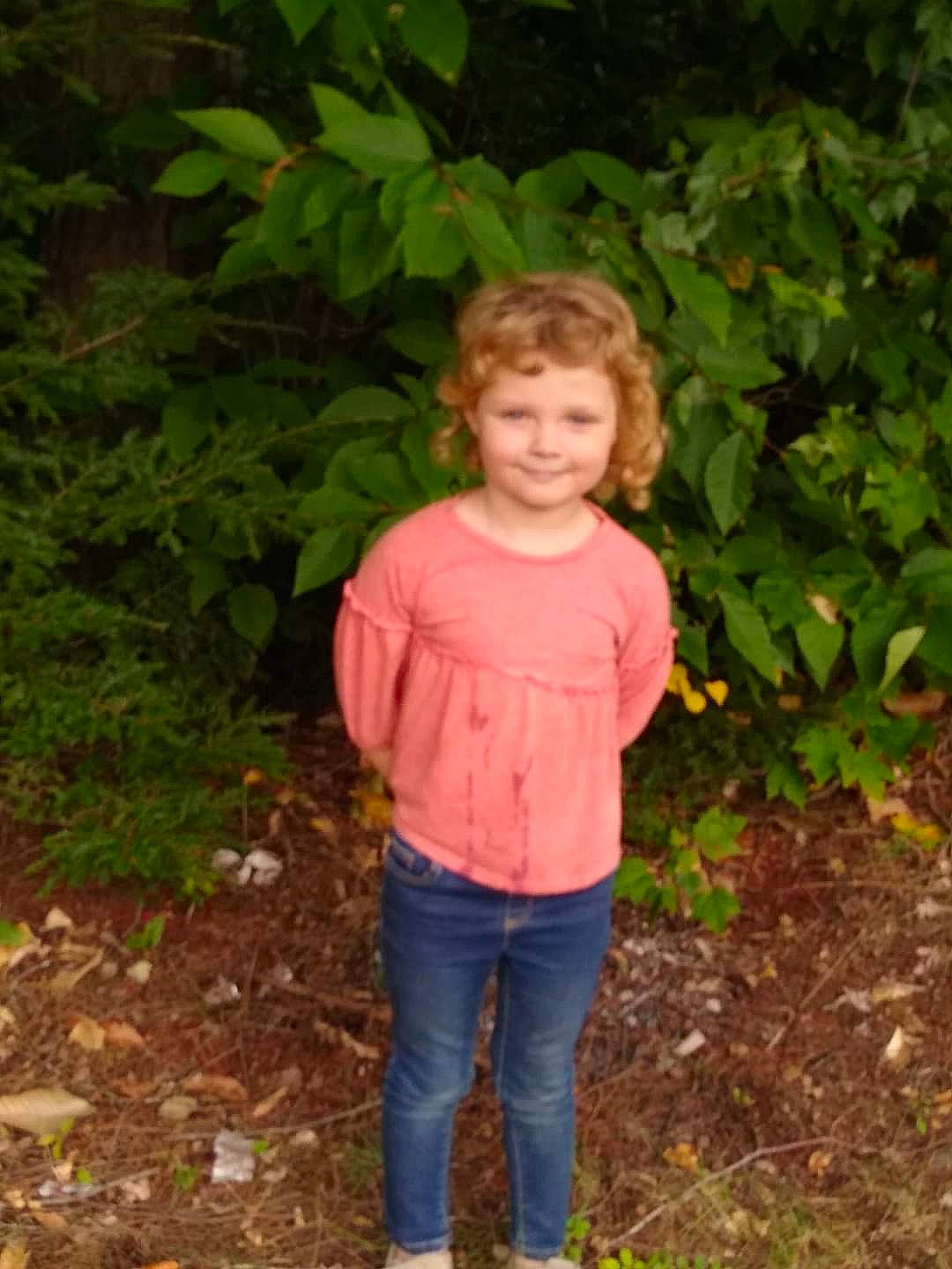 Catie joined the competition — help win amazing prizes! annual_plant, child, fun, garden, grass, groundcover, happy, jeans, joy, people_in_nature, person, plant, shrub, sleeve, smile, soil, t_shirt, toddler, tree, wood