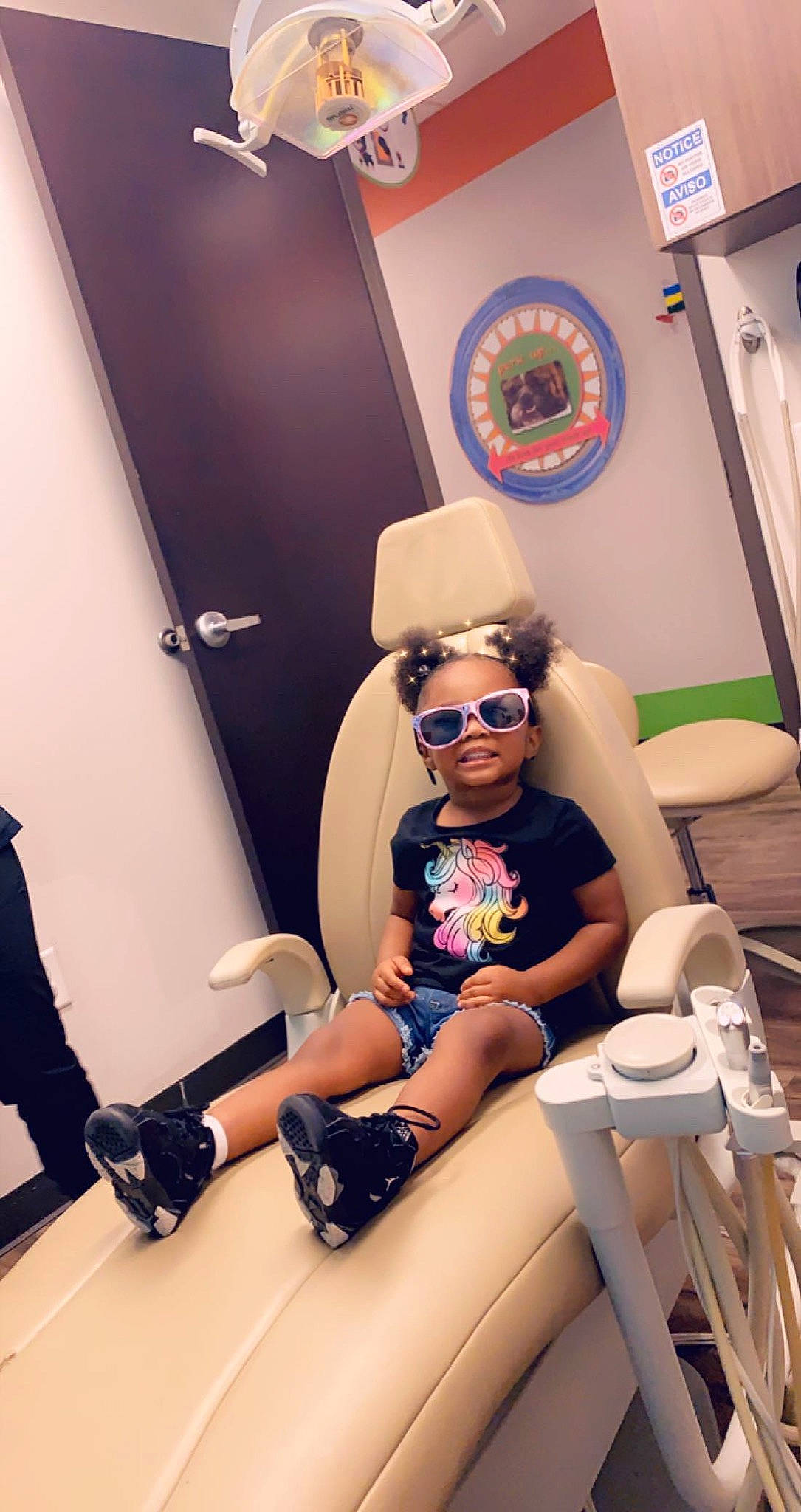 Takyla joined the competition — help win amazing prizes! automotive_design, cap, child, comfort, eyewear, fun, goggles, hat, headgear, human_leg, knee, leisure, person, personal_protective_equipment, sandal, shorts, smile, sunglasses, thigh, toddler