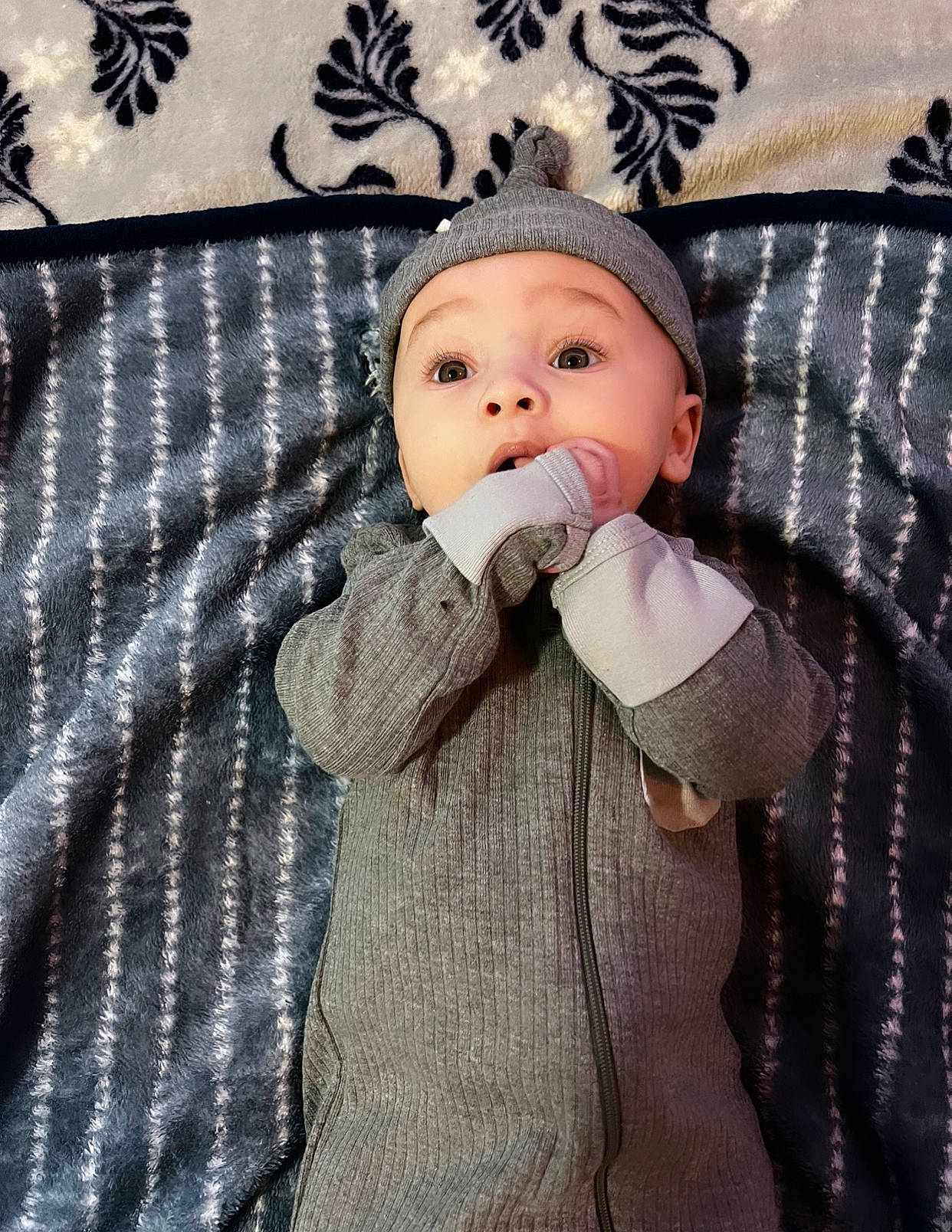 Keith is registered to the contest to win money with this photo: baby, baby_products, baby_safety, baby_sleeping, baby_toddler_clothing, cap, cheek, child, comfort, eye, headwear, jacket, linens, lip, outerwear, pattern, person, product, room, sleeve