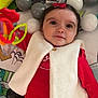 Layana a rejoint le concours — aidez-le/la à gagner de superbes lots ! baby, child, infant, red_clothing, white_vest, playmat, toy, ball, colorful, indoor, cute, face, head, hand, smile, bow, lying_down, soft_toy, background, curious