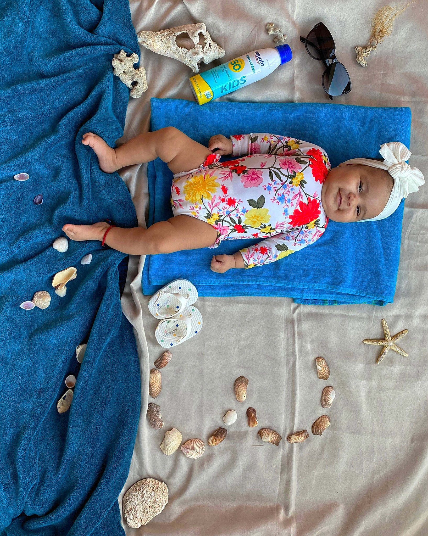 Keilani is registered to the contest to win money with this photo: aqua, azure, baby, baby_toddler_clothing, blue, child, day_dress, denim, design, electric_blue, fashion_accessory, fashion_design, headwear, linens, magenta, outerwear, pattern, person, sleeve, t_shirt