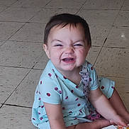 Kailee joined the competition — help win amazing prizes! baby, child, infant, smiling, laughing, sitting, floor, tile, indoor, portrait, face, short_hair, blue_clothing, dress, diaper_wipes, packaging, household_item, happy, playful, lifestyle