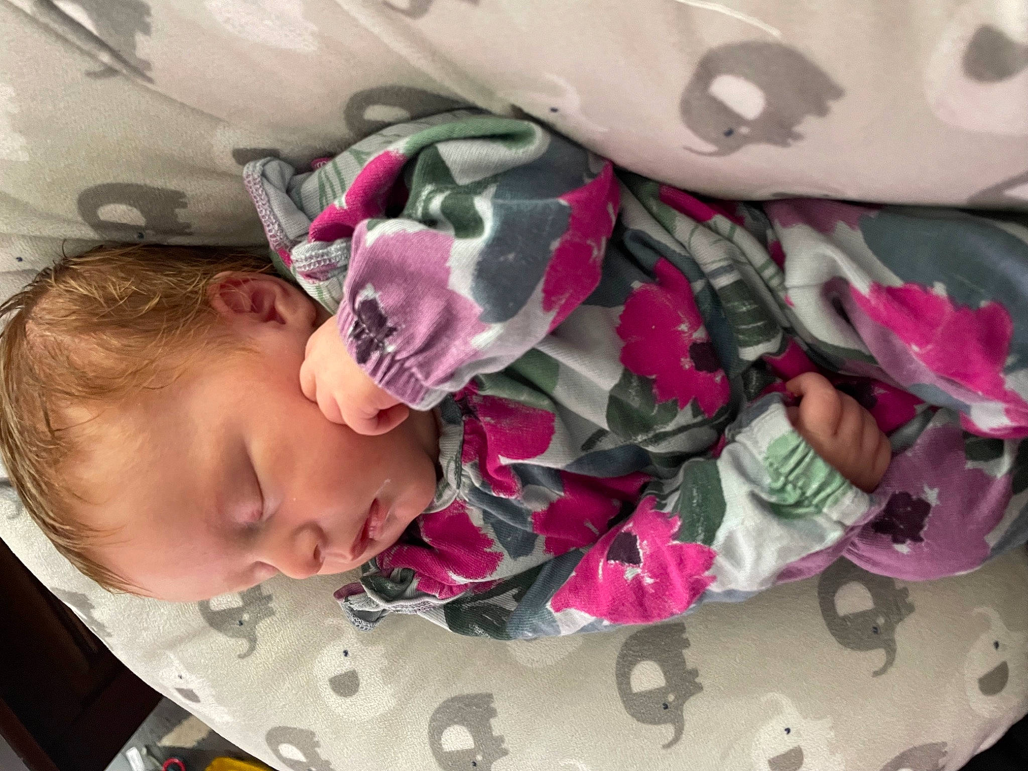 Ellie is registered to the contest to win money with this photo: baby, baby_products, baby_toddler_clothing, carmine, cheek, child, comfort, fashion_accessory, happy, linens, magenta, pattern, person, petal, pink, purple, sleeve, textile, toddler, violet
