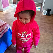 Elea a rejoint le concours — aidez-le/la à gagner de superbes lots ! toddler, child, hoodie, red_clothing, barefoot, indoor, wooden_floor, stairs, boots, folded_clothes, person, looking_down, casual_wear, cute, young_child, home, flooring, sweatshirt, pants, cozy