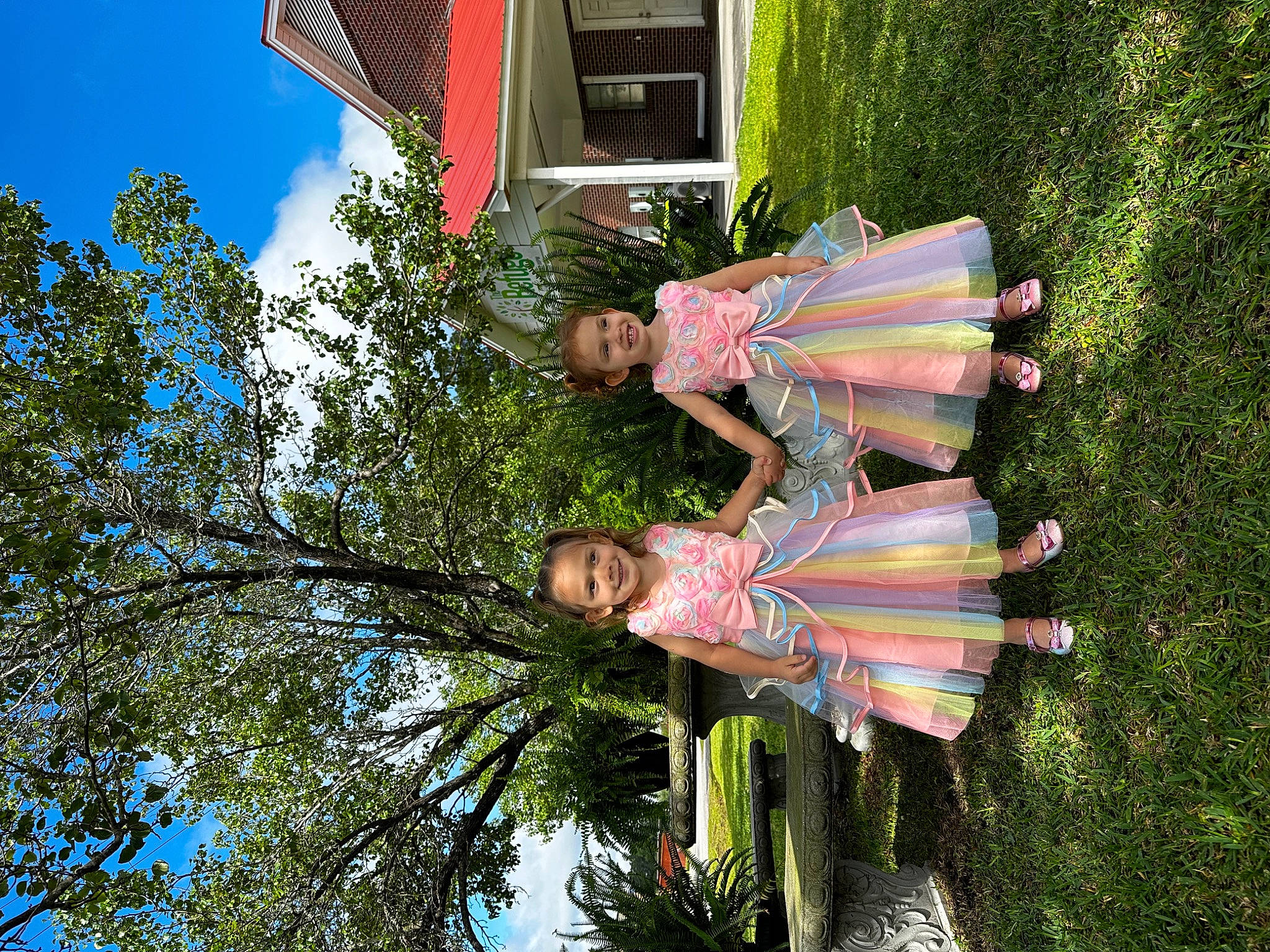 Stevie is registered to the contest to win money with this photo: art, building, fun, garden, grass, green, happy, joy, leisure, people_in_nature, person, plant, pole, sky, smile, tree, vegetation