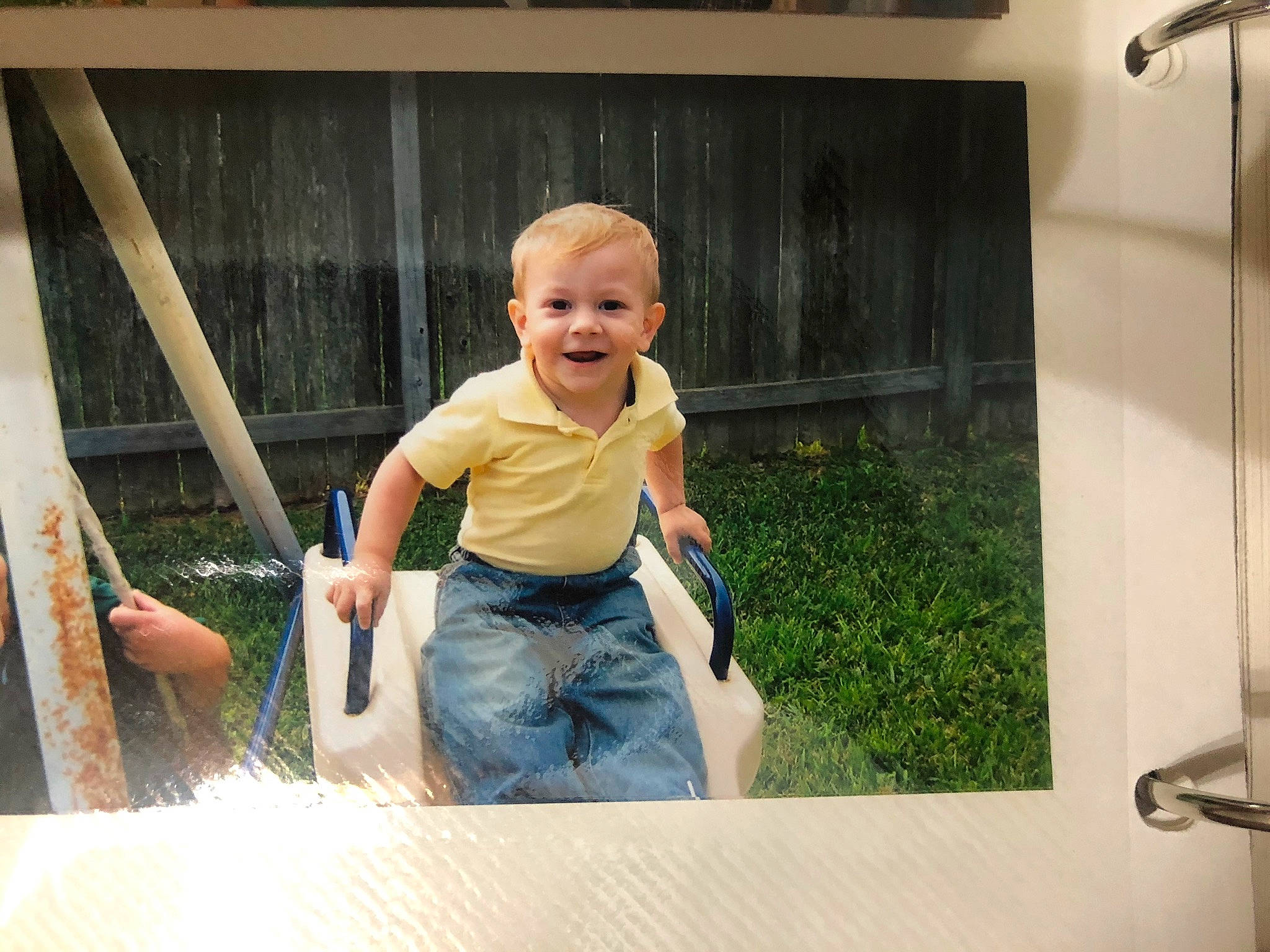 Yosvany joined the competition — help win amazing prizes! baby, baby_toddler_clothing, child, fun, grass, happy, joy, leisure, outdoor_play_equipment, person, photo_caption, recreation, room, shirt, shorts, sitting, smile, t_shirt, toddler, vacation