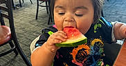 Amelia is registered to the contest to win money with this photo: adult, baby, diningtable, eating, face, female, food, furniture, head, indoors, lunch, male, man, meal, person, photography, portrait, restaurant, table, woman