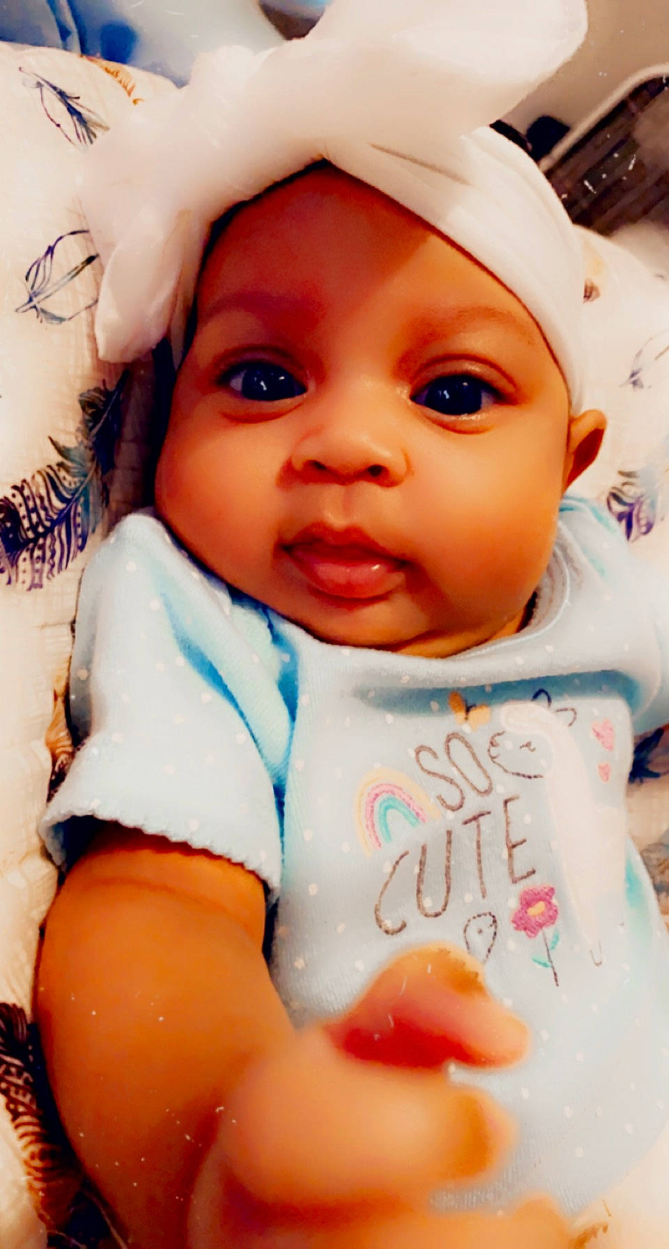 Nalani is registered to the contest to win money with this photo: baby, baby_products, baby_toddler_clothing, cap, cheek, child, eye, eyebrow, eyelash, finger, gesture, happy, hat, headwear, iris, lip, mouth, nose, person, skin